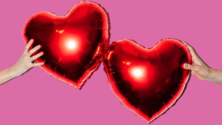 share economy two red hearts held centre frame