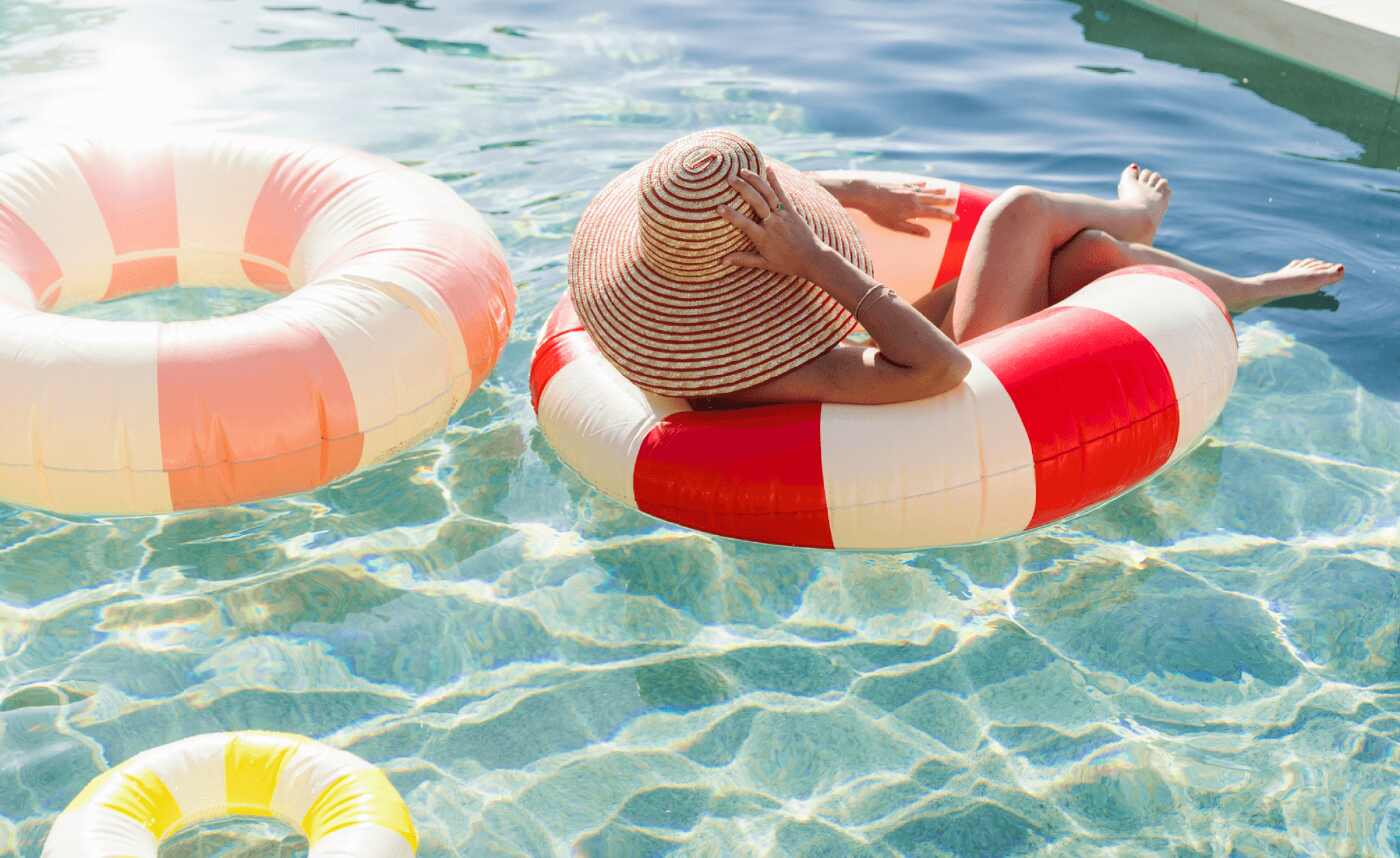 swimming pool with floaty rings to signify relaxing in retirement