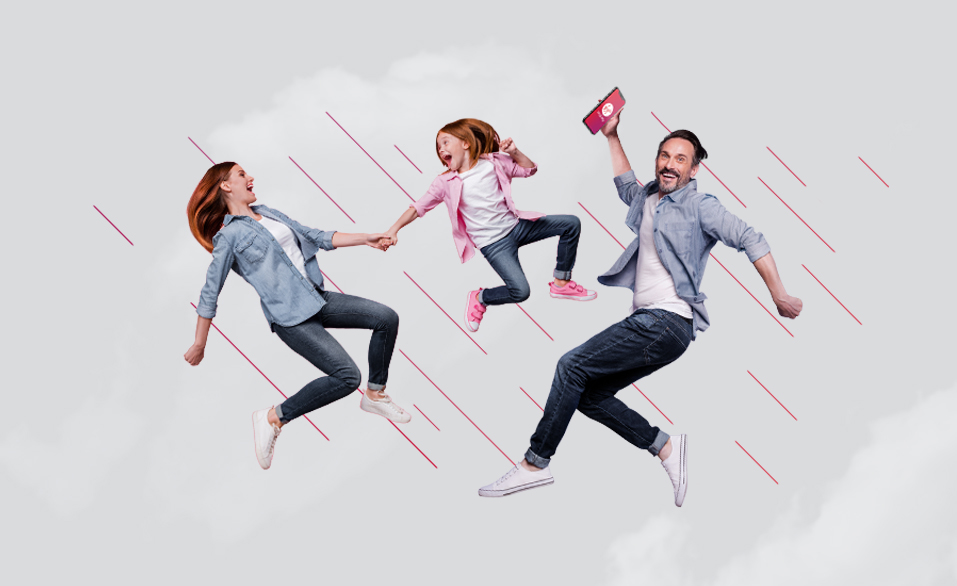 Woman, girl and man jumping for joy. The man is holding a mobile phone with the Virgin Money app on the screen.