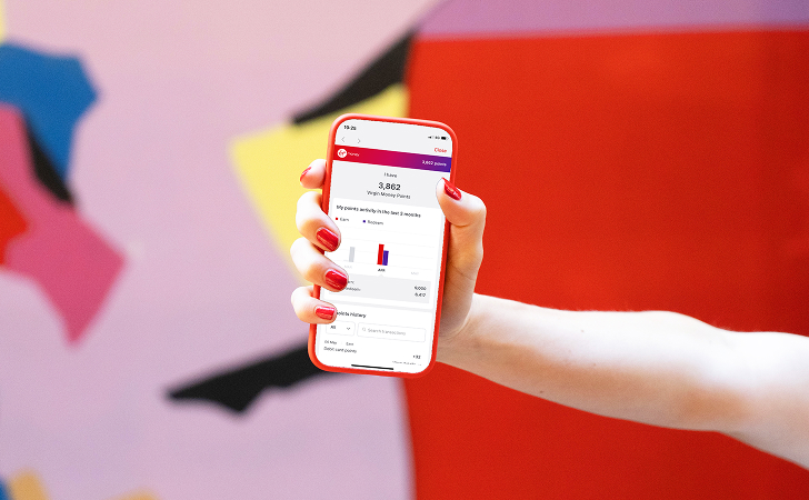 Person holding a phone showing Virgin Money Reward points on their home loan