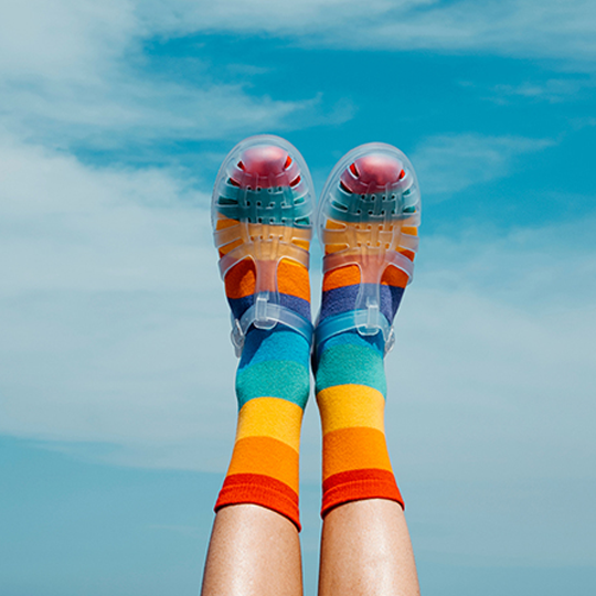 A person kicking their feet up celebrating bonus Virgin Money points with their new home loan