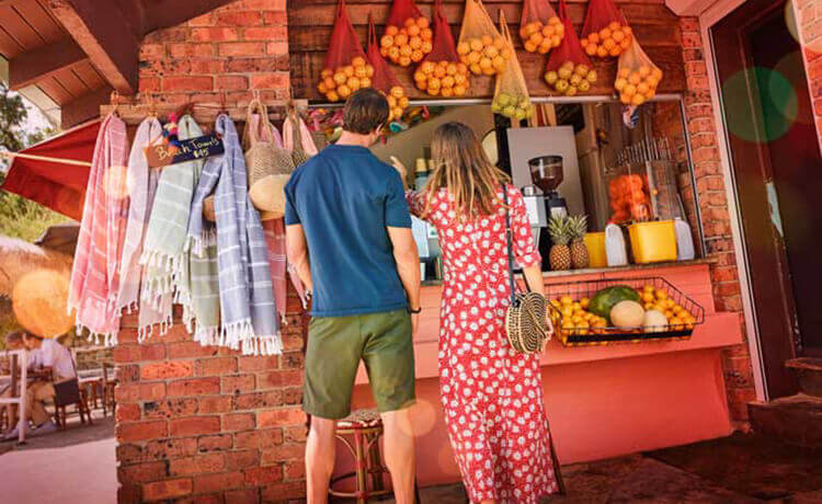 Couple at coffee and juice stand