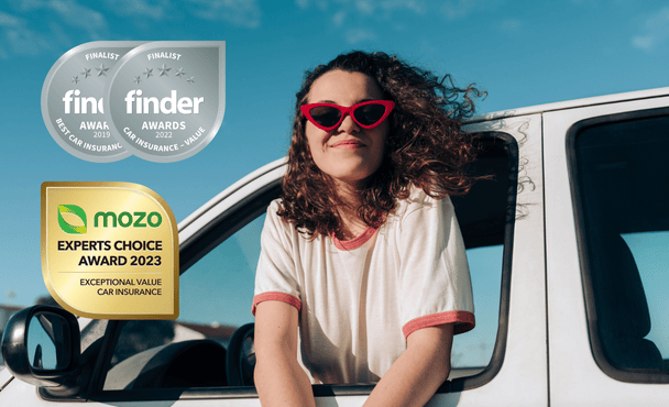 Young woman looking at three different car insurance awards